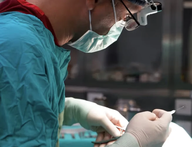 Profile shot of surgeon operating