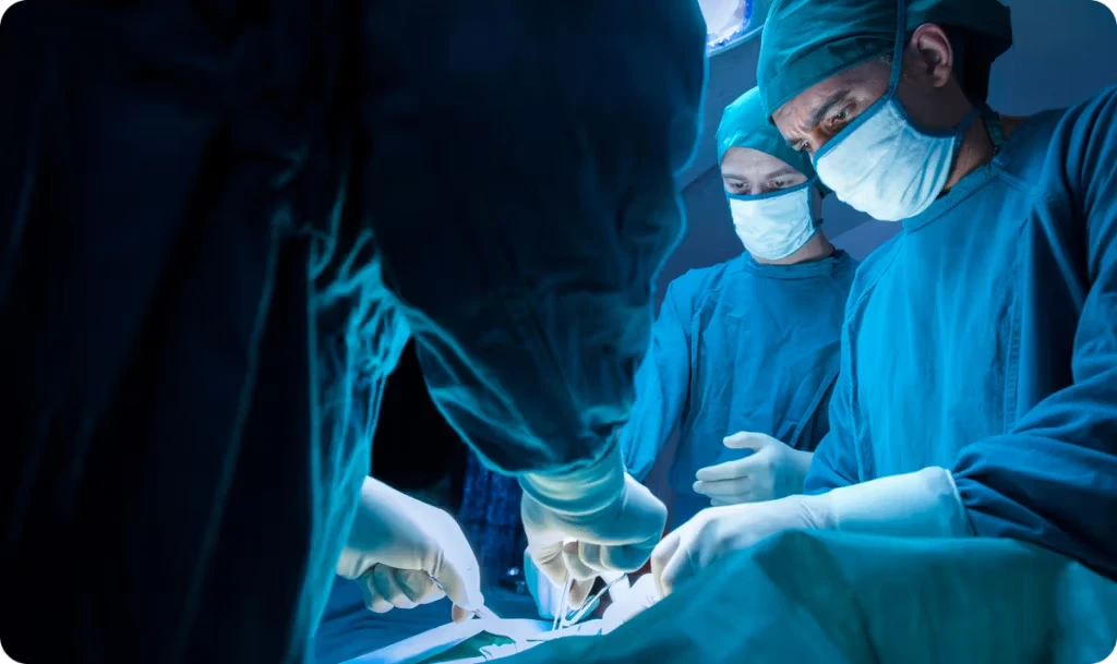 masked surgeons performing surgery