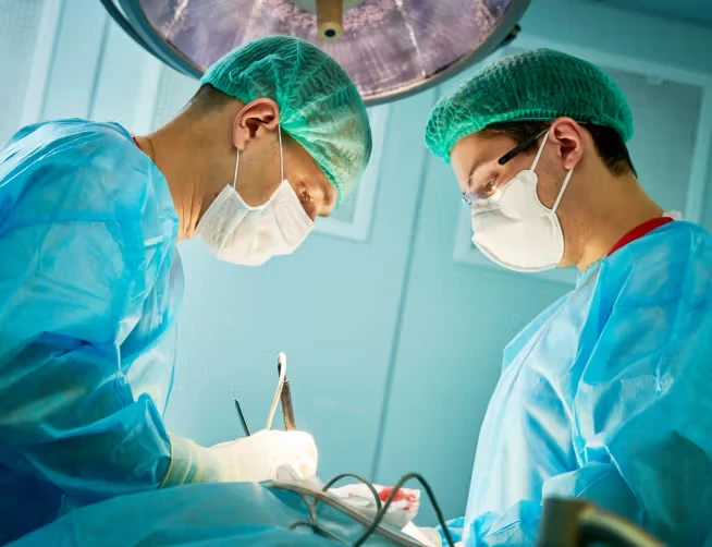 Two surgeons operating